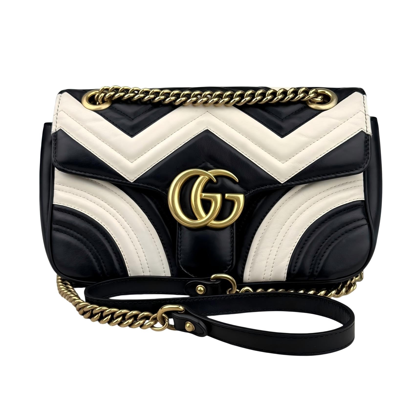 Gucci GG Marmont handbag in black and white quilted leather Gucci GG Marmont handbag in black and white quilted leather