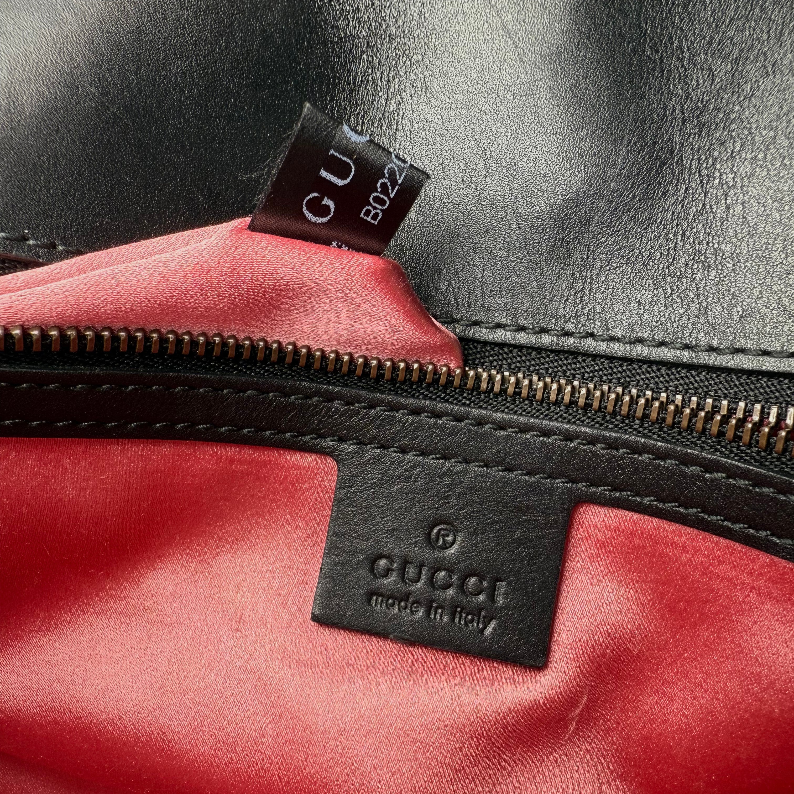 Gucci GG Marmont handbag in black and white quilted leather Gucci GG Marmont handbag in black and white quilted leather