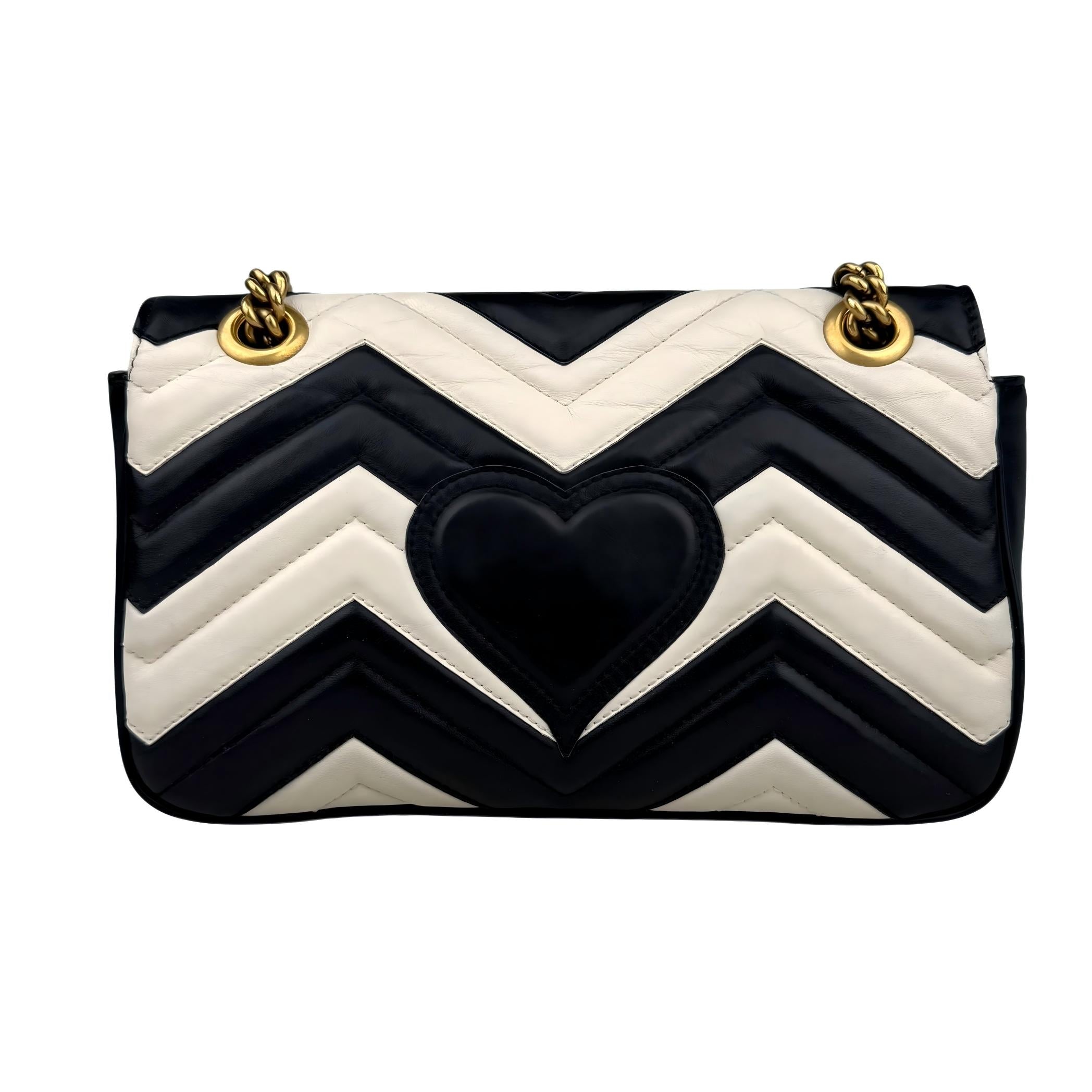 Gucci GG Marmont handbag in black and white quilted leather Gucci GG Marmont handbag in black and white quilted leather