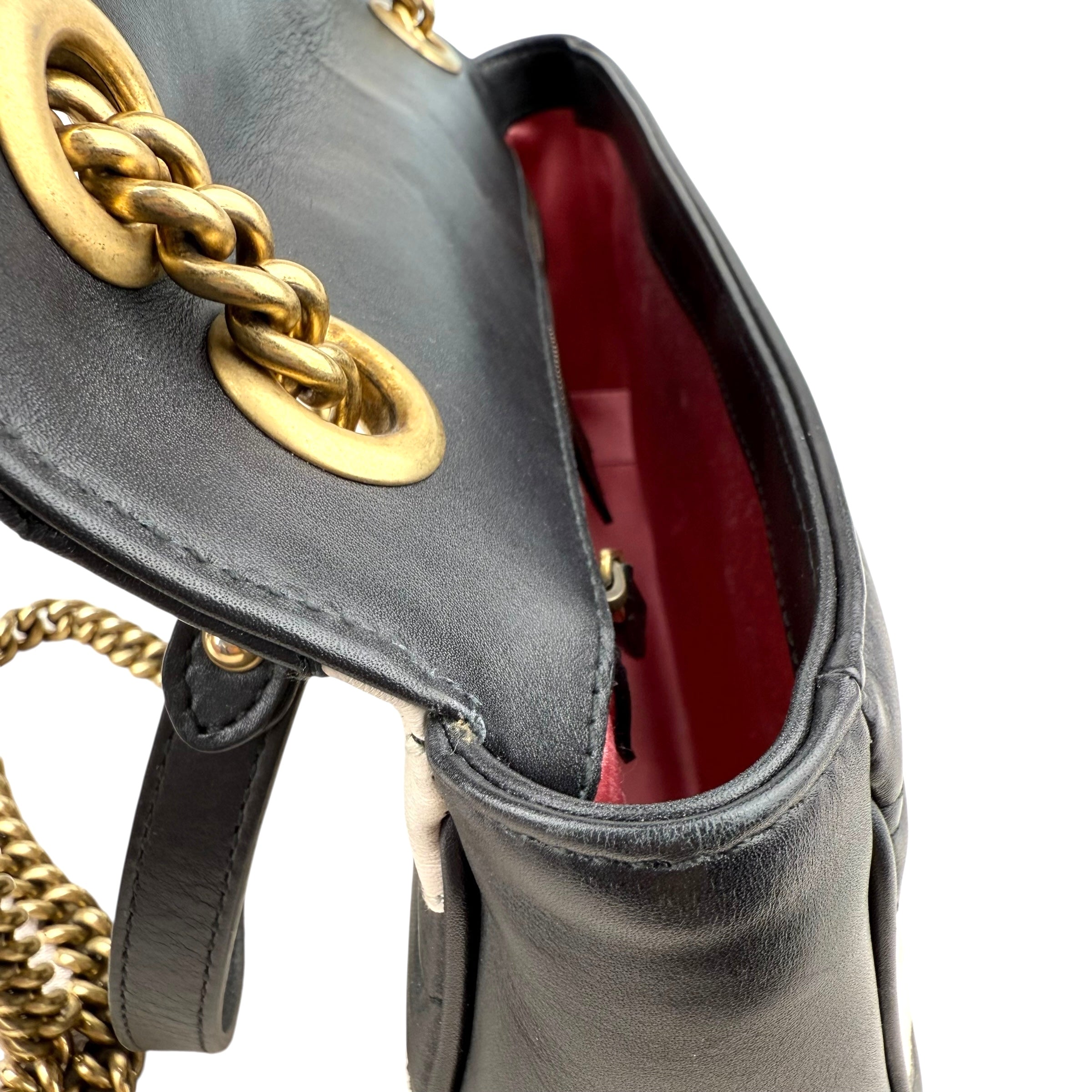 Gucci GG Marmont handbag in black and white quilted leather Gucci GG Marmont handbag in black and white quilted leather