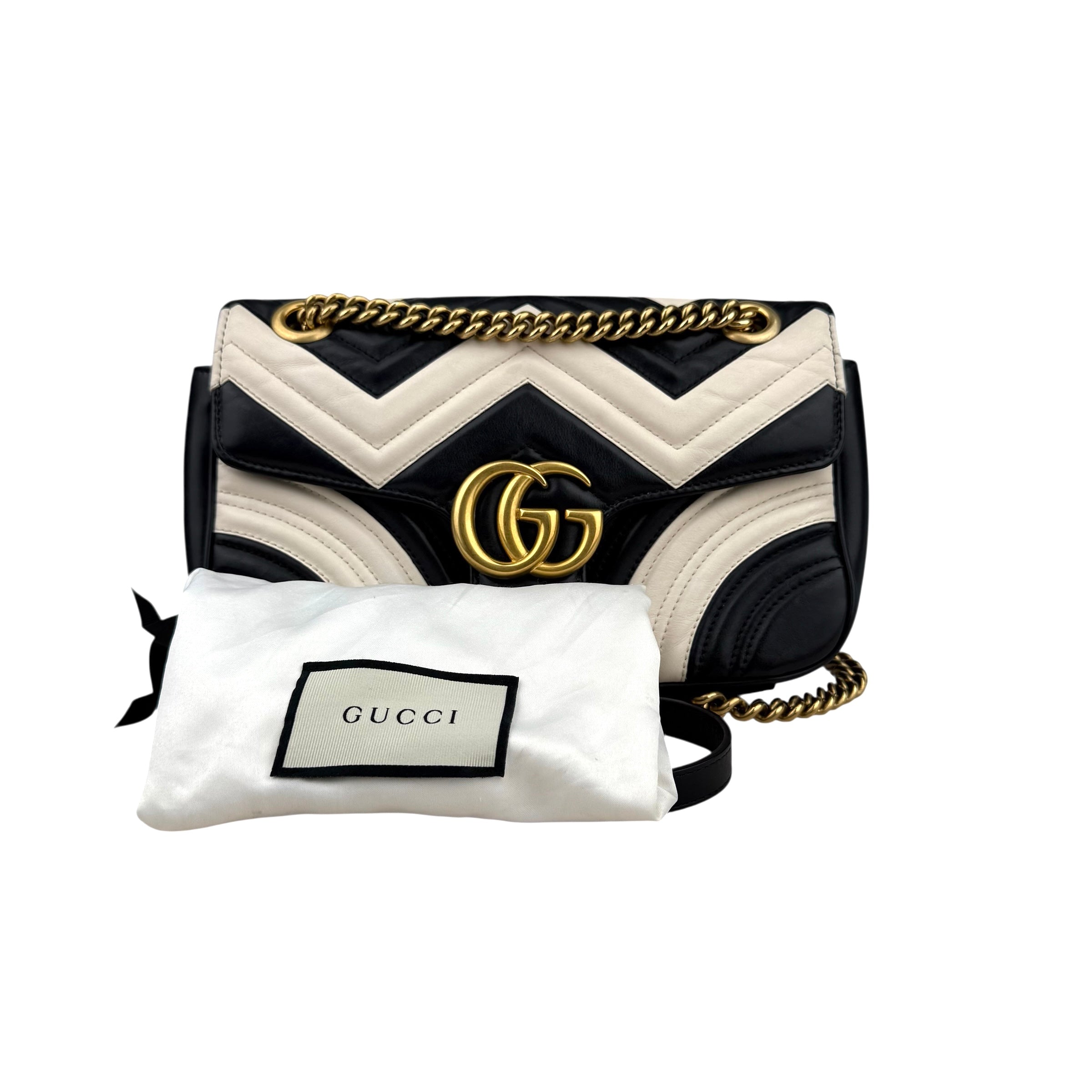 Gucci GG Marmont handbag in black and white quilted leather Gucci GG Marmont handbag in black and white quilted leather