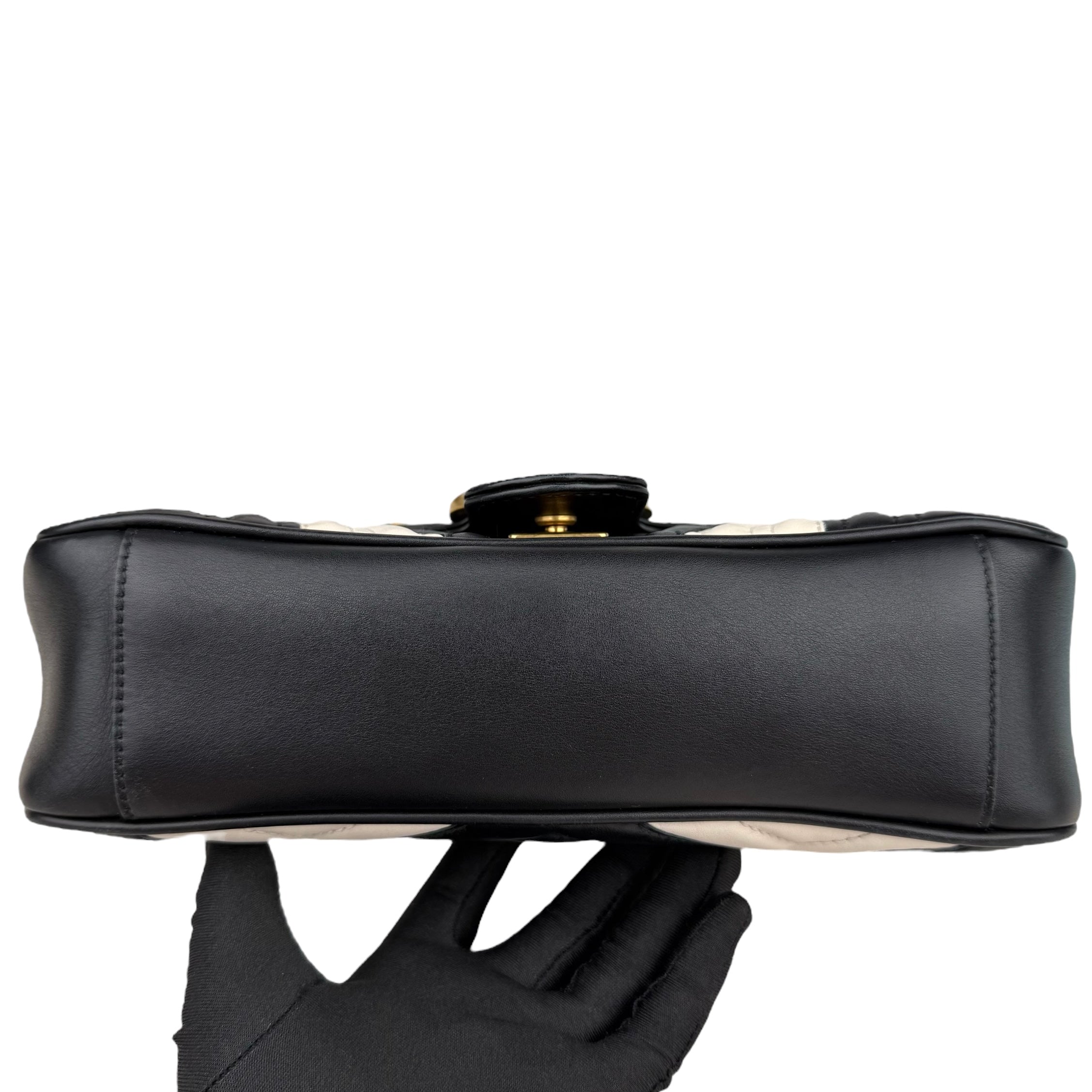 Gucci GG Marmont handbag in black and white quilted leather Gucci GG Marmont handbag in black and white quilted leather