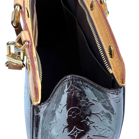 Louis Vuitton Bréa patent leather handbag