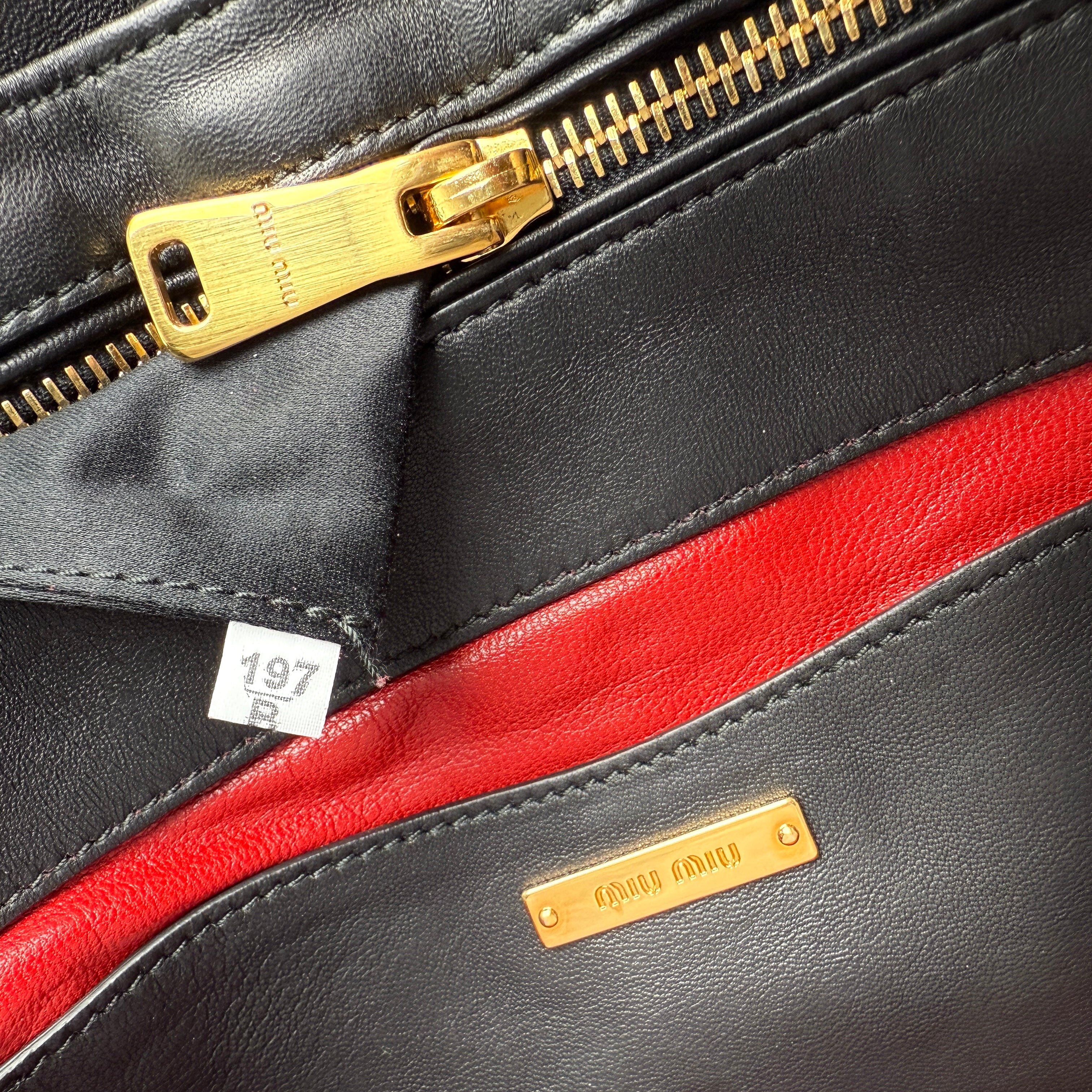 Pre-owned miu-miu-black-quilted-leather-biker-top-handle-bag-front