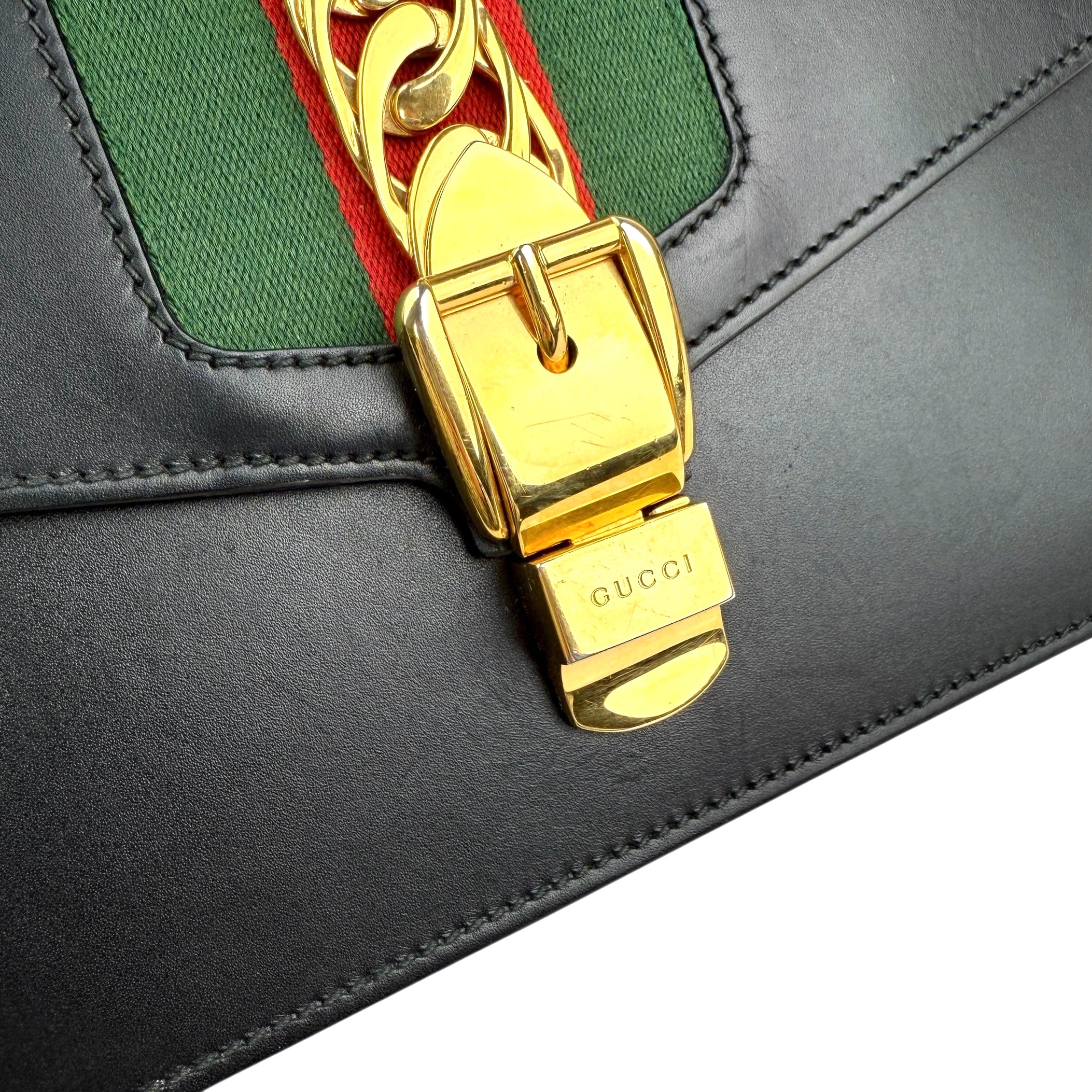 gucci black leather web sylvie shoulder bag hardware detail