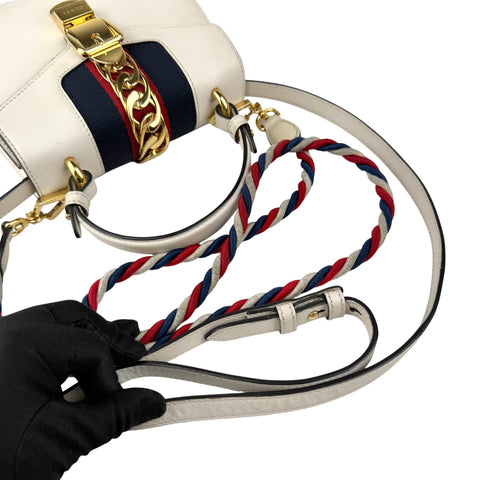 gucci calfskin mini sylvie top handle bag white left front 45