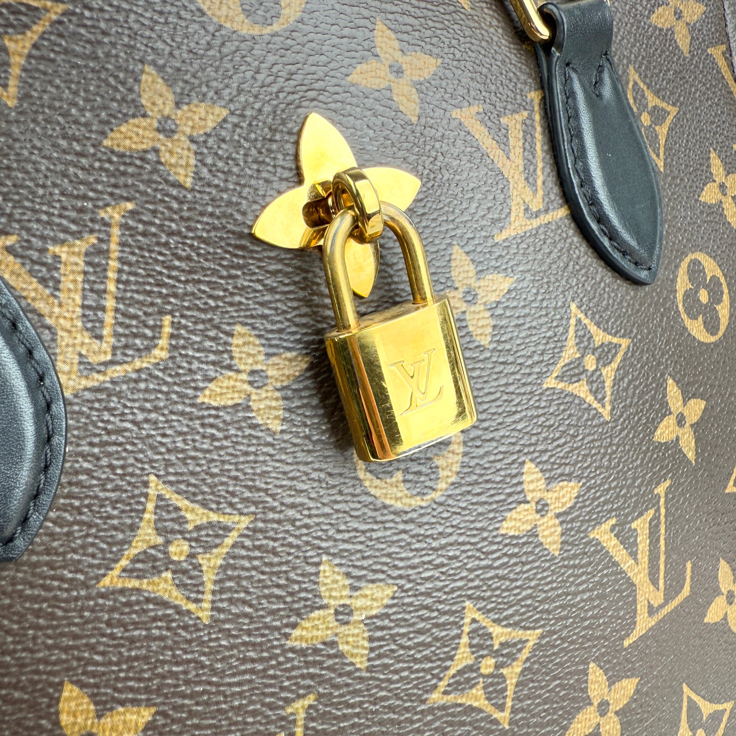 louis vuitton monogram canvas flower tote bag hardware detail