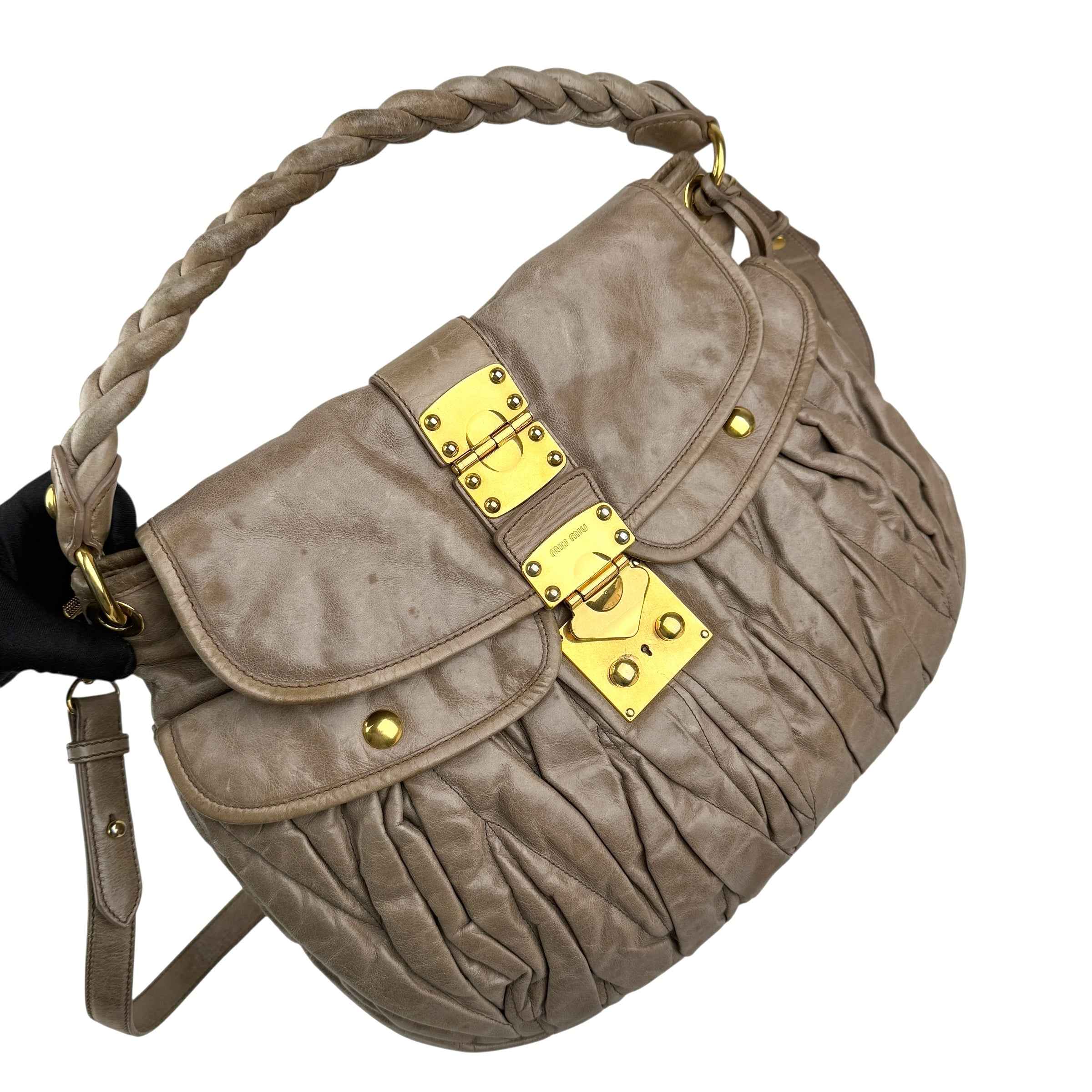 miu-miu-matelasse-leather-handbag-left